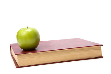 Image showing book with apple isolated on white background 