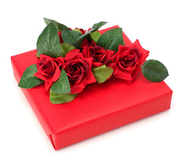 Image showing Gift with floral decor. Flowers are artificial. 