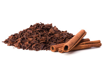 Image showing grated chocolate and cinnamon isolated on white background