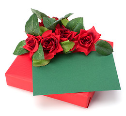 Image showing Gift with floral decor. Flowers are artificial. 