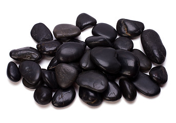Image showing Heap of black pebbles isolated on white background