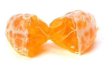 Image showing peeled mandarin segment isolated on white background