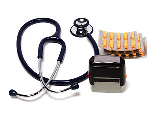 Image showing stethoscope, tablets  and doctor seal isolated on white backgrou