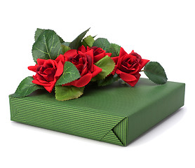 Image showing Gift with floral decor. Flowers are artificial. 