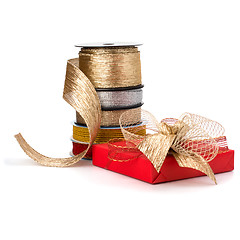 Image showing Festive gift box and wrapping ribbons isolated on white backgrou