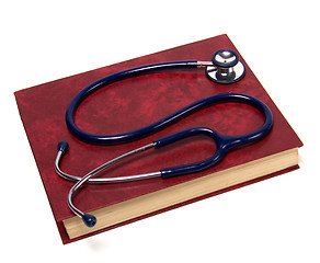 Image showing stethoscope on red book isolated on white background