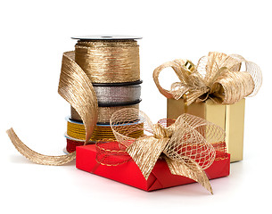 Image showing Festive gift box and wrapping ribbons isolated on white backgrou