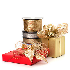 Image showing Festive gift box and wrapping ribbons isolated on white backgrou