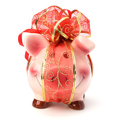 Image showing Christmas deposit concept. Piggy bank with festive bow isolated 