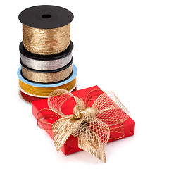 Image showing Festive gift box and wrapping ribbons isolated on white backgrou