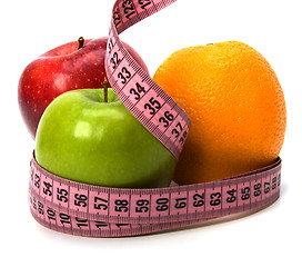 Image showing  tape measure wrapped around fruits isolated on white background