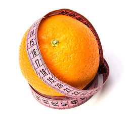 Image showing  tape measure wrapped around the orange isolated on white backgr