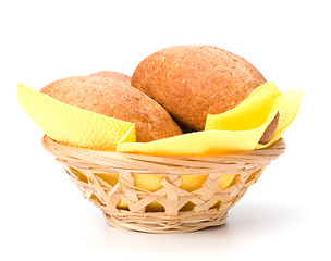 Image showing fresh warm rolls in breadbasket isolated on white background