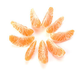 Image showing peeled mandarin segments isolated on white background