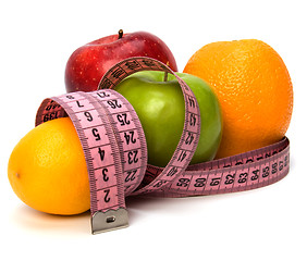 Image showing  tape measure wrapped around fruits isolated on white background