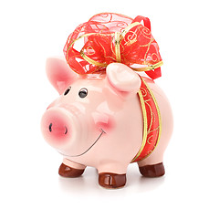 Image showing Christmas deposit concept. Piggy bank with festive bow isolated 