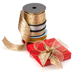 Image showing Festive gift box and wrapping ribbons isolated on white backgrou