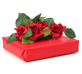 Image showing Gift with floral decor. Flowers are artificial. 