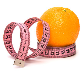 Image showing  tape measure wrapped around the orange isolated on white backgr