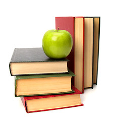 Image showing book stack with apple isolated on white background 