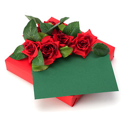 Image showing Gift with floral decor. Flowers are artificial. 