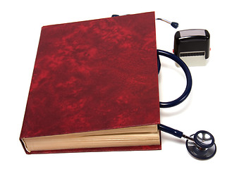 Image showing stethoscope on red book isolated on white background