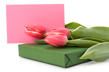 Image showing gift with pink tulips  isolated on white background