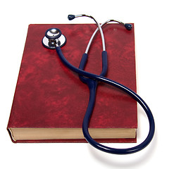 Image showing stethoscope on red book isolated on white background