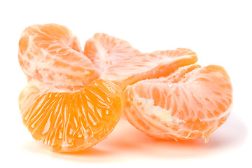 Image showing peeled mandarin segments isolated on white background