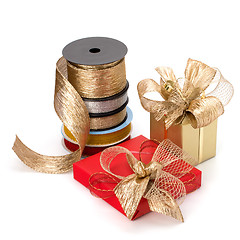 Image showing Festive gift box and wrapping ribbons isolated on white backgrou