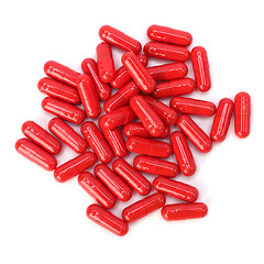 Image showing red capsules isolated on white background