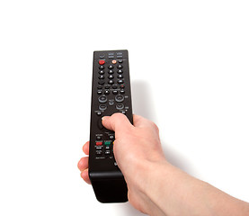 Image showing Hand holding tv remote control isolated on white background 