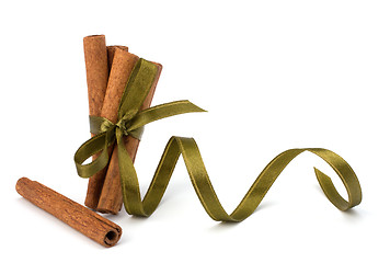 Image showing Festive wrapped cinnamon sticks 