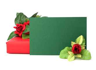 Image showing Gift with floral decor. Flowers are artificial. 