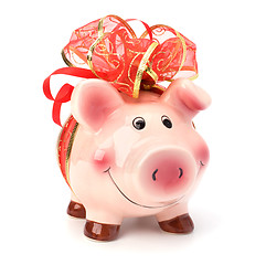 Image showing Christmas deposit concept. Piggy bank with festive bow isolated 