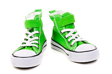 Image showing green sneakers with white laces