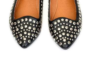 Image showing Black women's leather ballet flats with steel rivets close up 