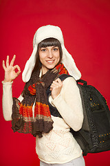 Image showing Winter woman tourist with backpack