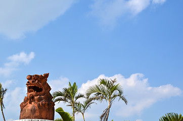 Image showing Doglion at palm trees