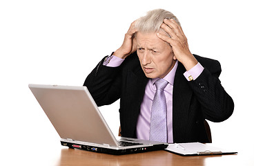 Image showing Mature man sitting at the computer