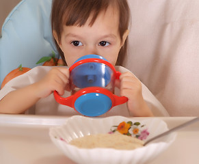 Image showing Little girl eating