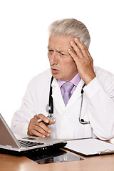 Image showing Elderly doctor with a laptop