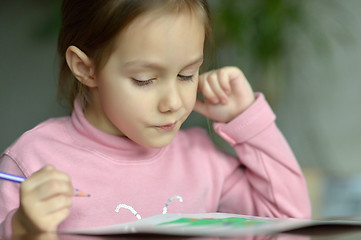 Image showing Little girl draws