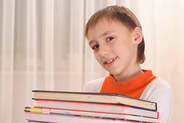 Image showing Young boy with books