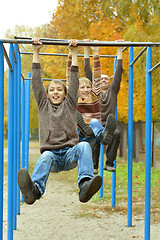 Image showing Father and sons in park