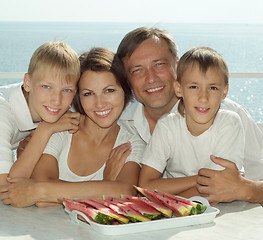 Image showing Beautiful family eating watermelon