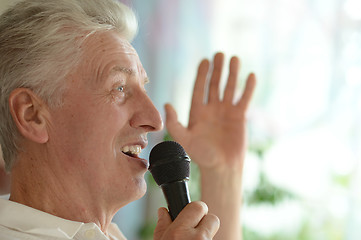 Image showing Senior man singing