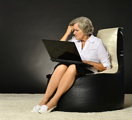 Image showing Happy beautiful senior woman with laptop