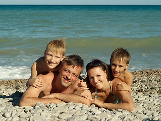 Image showing Family swimming in the sea