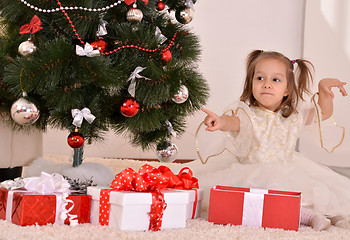 Image showing Little girl with Christmas gifts